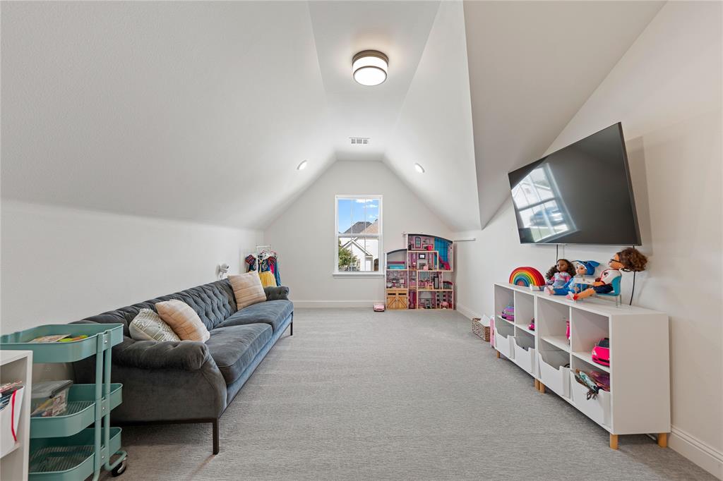 5244 Ranchero Trail Fort Worth, TX 76126 - Photo 26 of 33 Recreation room featuring vaulted ceiling and light colored carpet