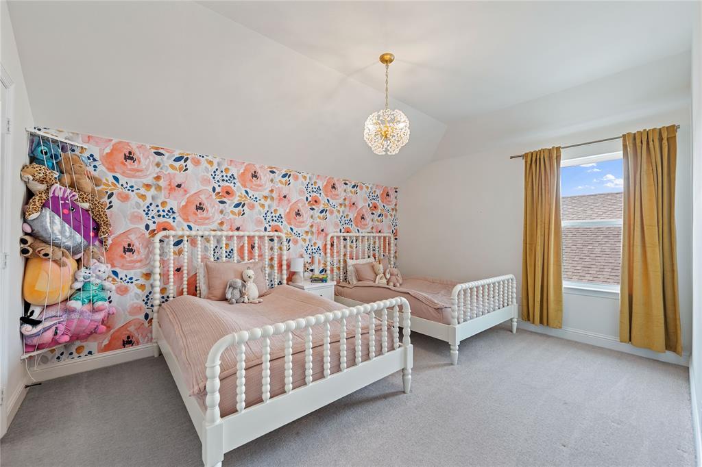 5244 Ranchero Trail Fort Worth, TX 76126 - Photo 28 of 33 Bedroom featuring vaulted ceiling, carpet floors, and a chandelier