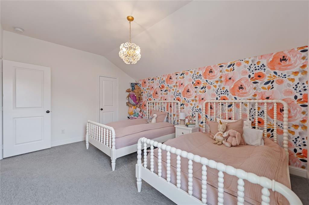5244 Ranchero Trail Fort Worth, TX 76126 - Photo 29 of 33 Carpeted bedroom with vaulted ceiling and a chandelier