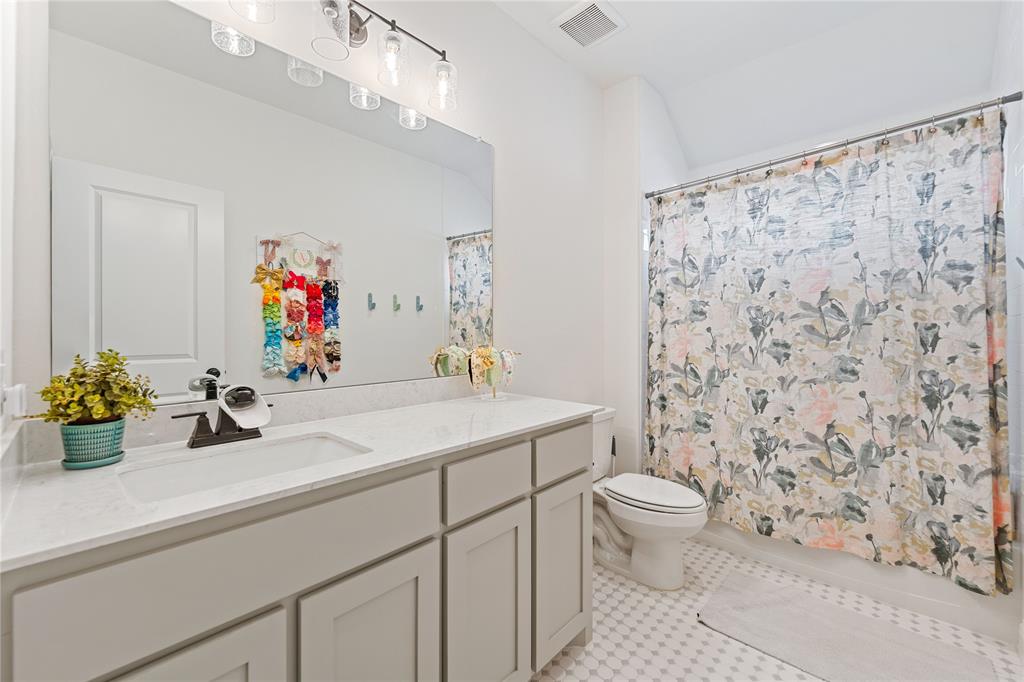 5244 Ranchero Trail Fort Worth, TX 76126 - Photo 31 of 33 Full bathroom with vanity and shower / tub combo with curtain