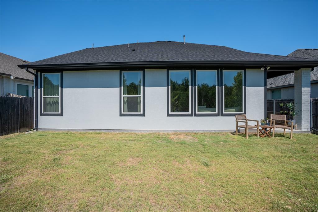 5244 Ranchero Trail Fort Worth, TX 76126 - Photo 33 of 33 Back of property with a shingled roof, stucco siding, and a patio area