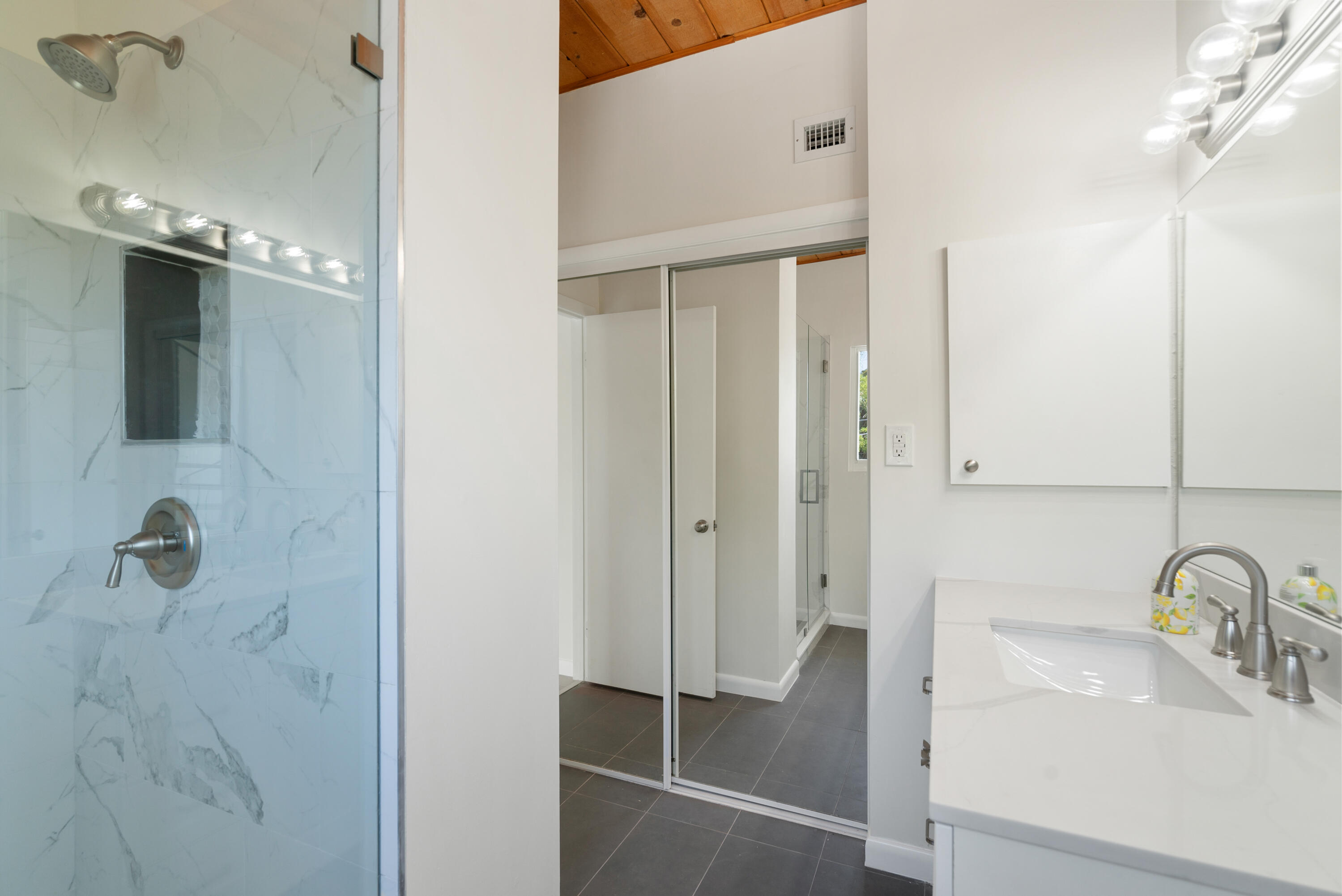 415 Big Pine Road Key Largo, FL 33037 - Photo 13 of 35 a bathroom with a sink and mirror