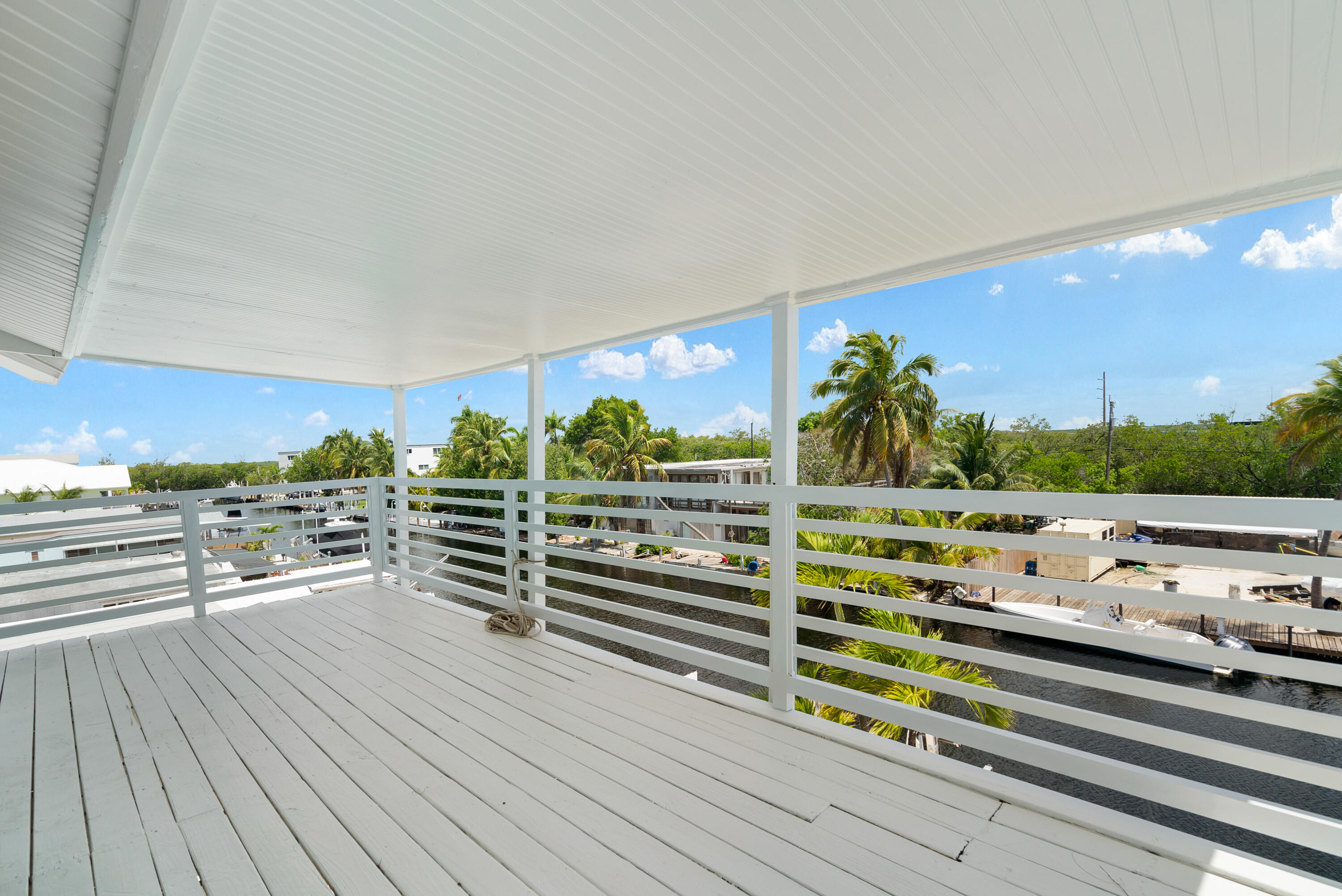 415 Big Pine Road Key Largo, FL 33037 - Photo 25 of 35 a view of a balcony with mountain view and wooden floor