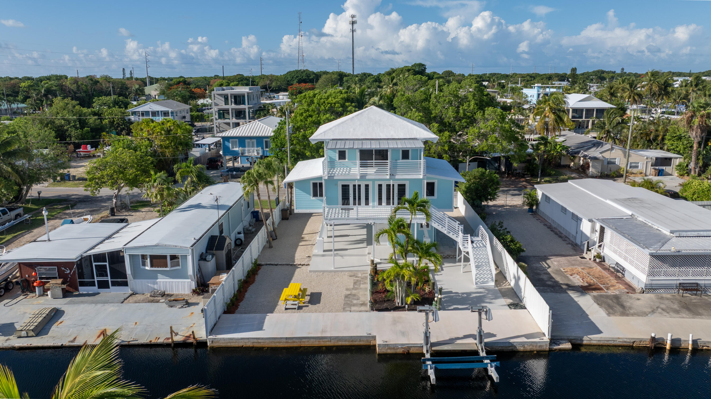 415 Big Pine Road Key Largo, FL 33037 - Photo 33 of 35 an aerial view of multiple houses with a yard