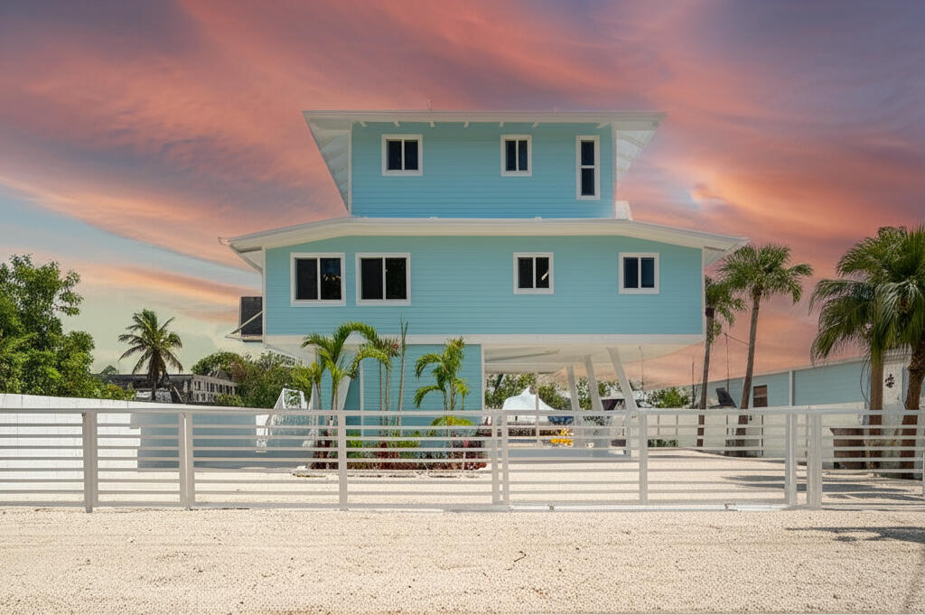 415 Big Pine Road Key Largo, FL 33037 - Photo 35 of 35 a front view of a house with a yard