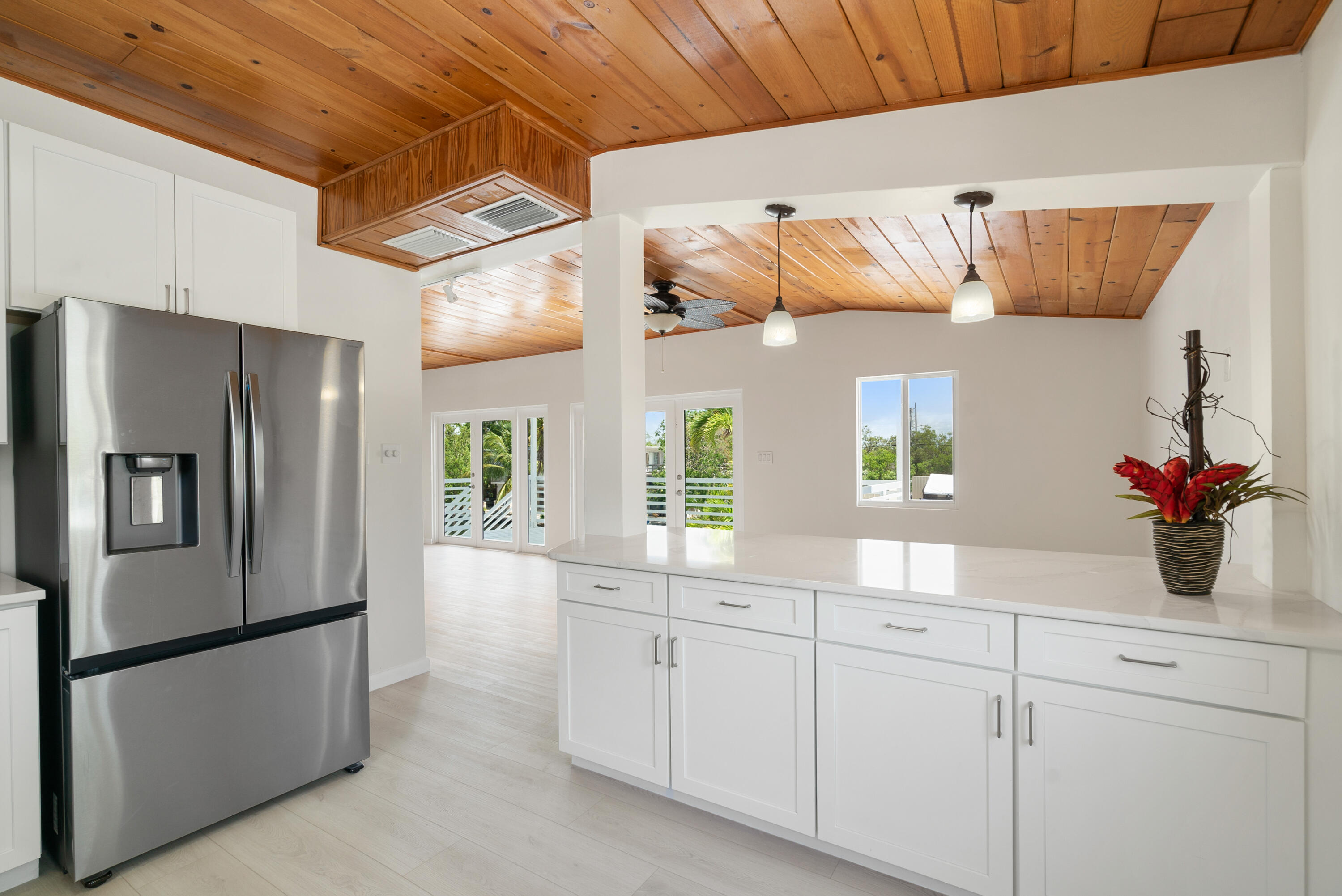 415 Big Pine Road Key Largo, FL 33037 - Photo 8 of 35 a kitchen with cabinets and stainless steel appliances