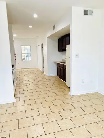a view of a livingroom with a flat screen tv