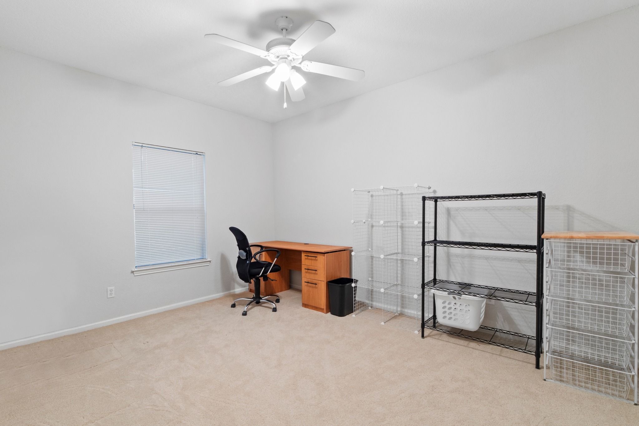 4711 Spicewood Springs Road, Unit 8146 Austin, TX 78759 - Photo 13 of 17 Carpeted interior room with a window, ceiling fan, and light-toned walls