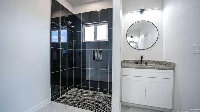 a bathroom with a sink and a mirror