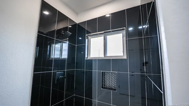 a bathroom with a walk in closet