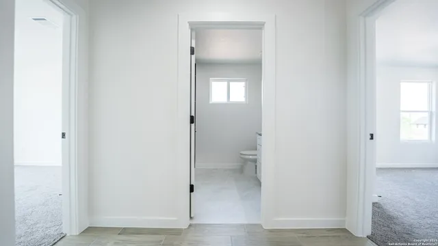 a bathroom view of a toilet and a sink