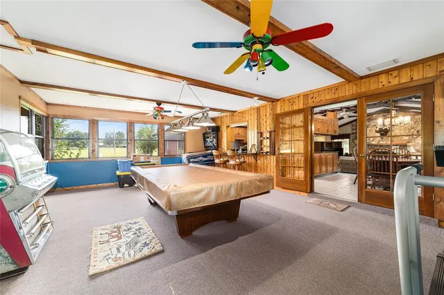 a bed room with a bed and a large window