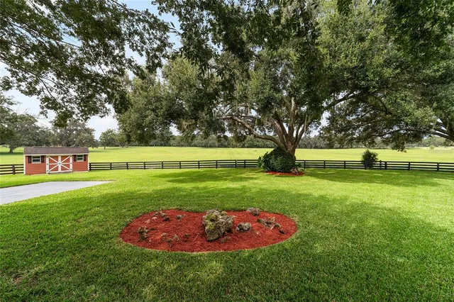 a view of an house with a backyard