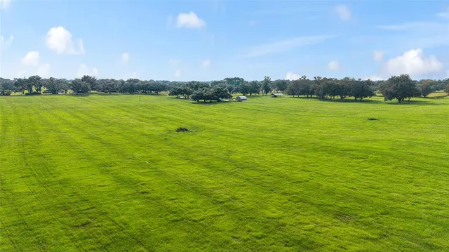 a view of yard with an outdoor space and seating
