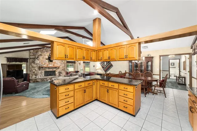 a kitchen with stainless steel appliances granite countertop a sink and cabinets