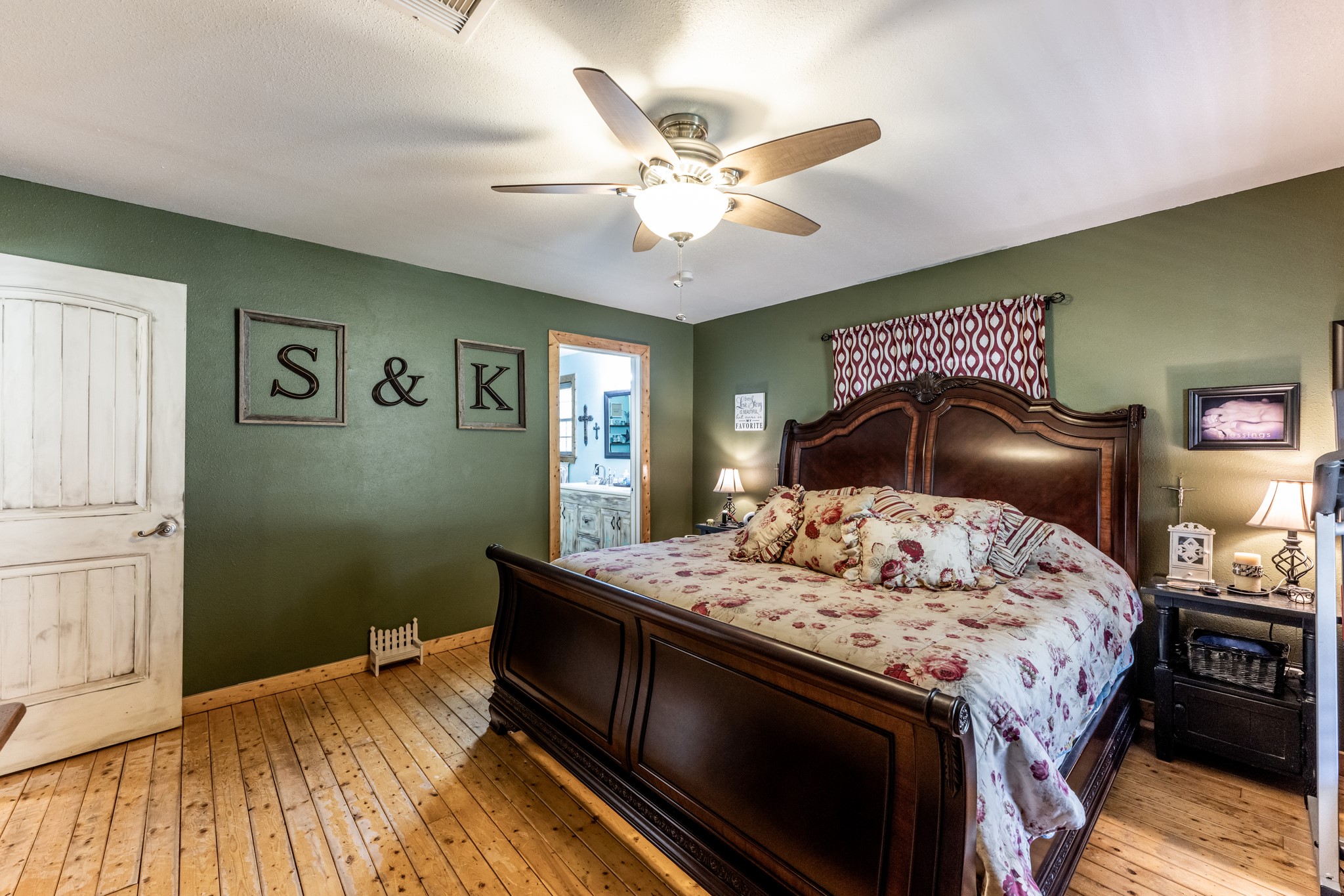 230 Thomas Creek Road Cleveland, TX 77328 - Photo 15 of 28 a bedroom with a bed and dresser with wooden floor