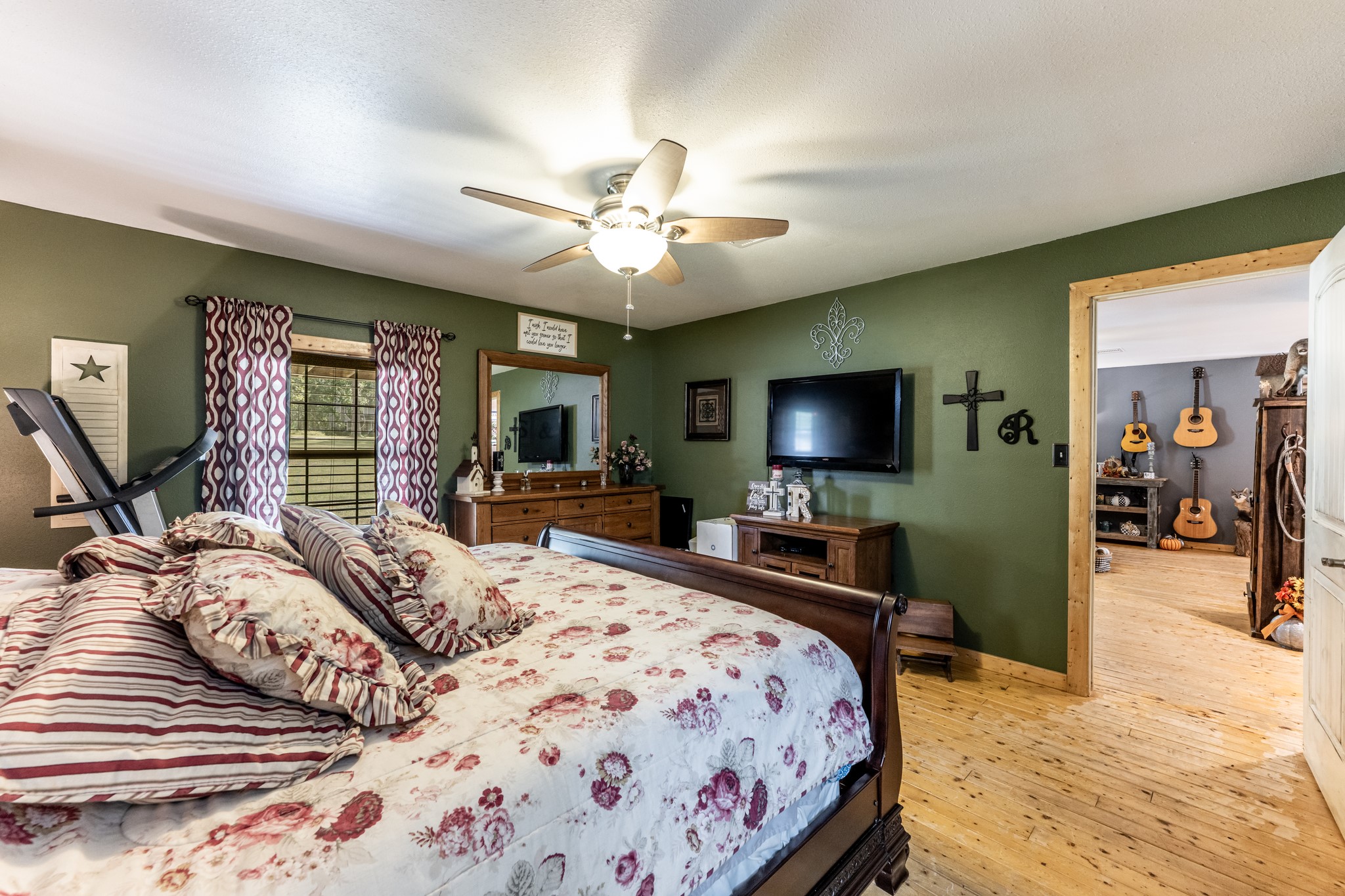 230 Thomas Creek Road Cleveland, TX 77328 - Photo 16 of 28 a bedroom with a bed and a flat screen tv