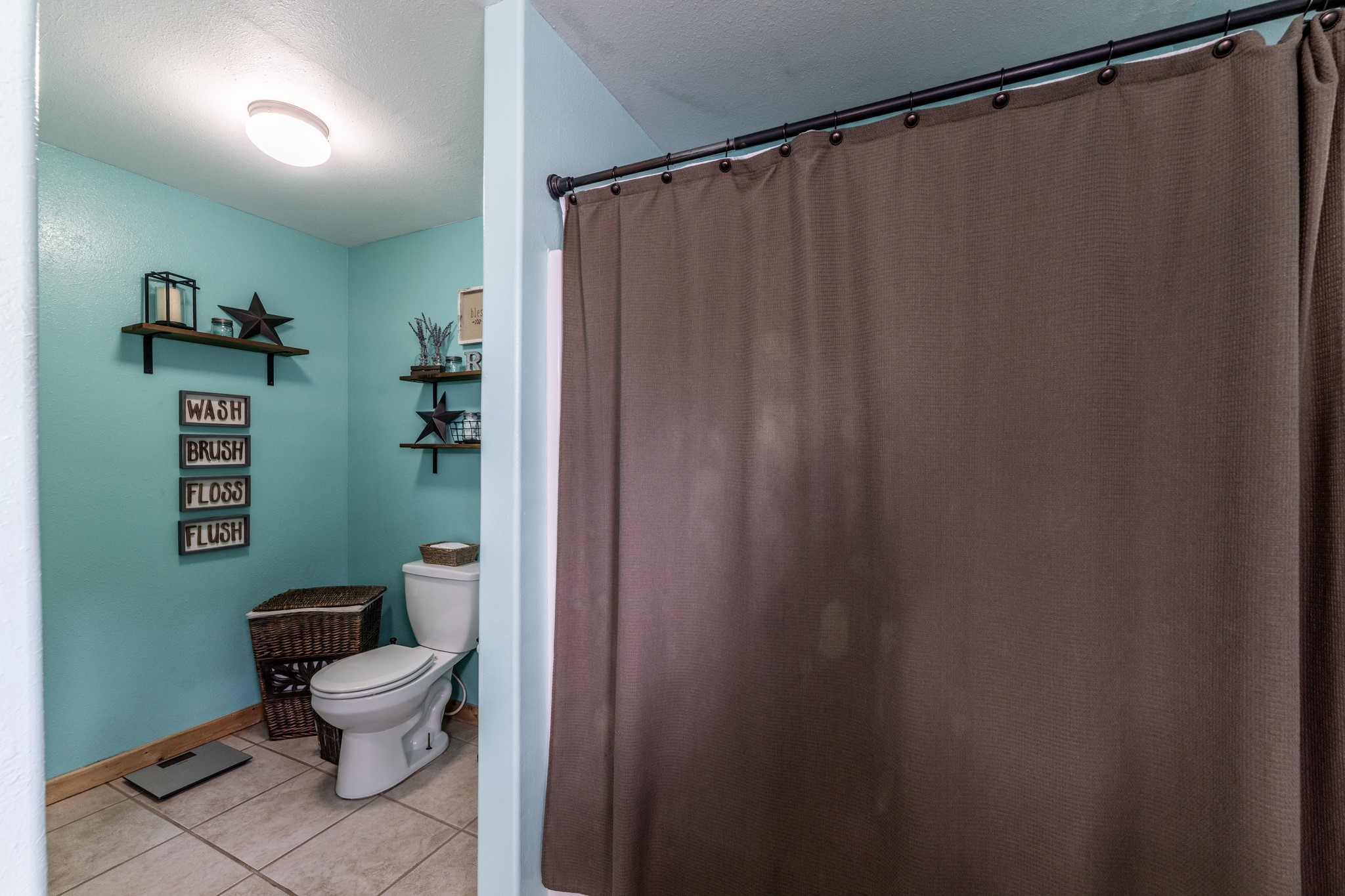 230 Thomas Creek Road Cleveland, TX 77328 - Photo 18 of 28 a bathroom with a sink and a toilet