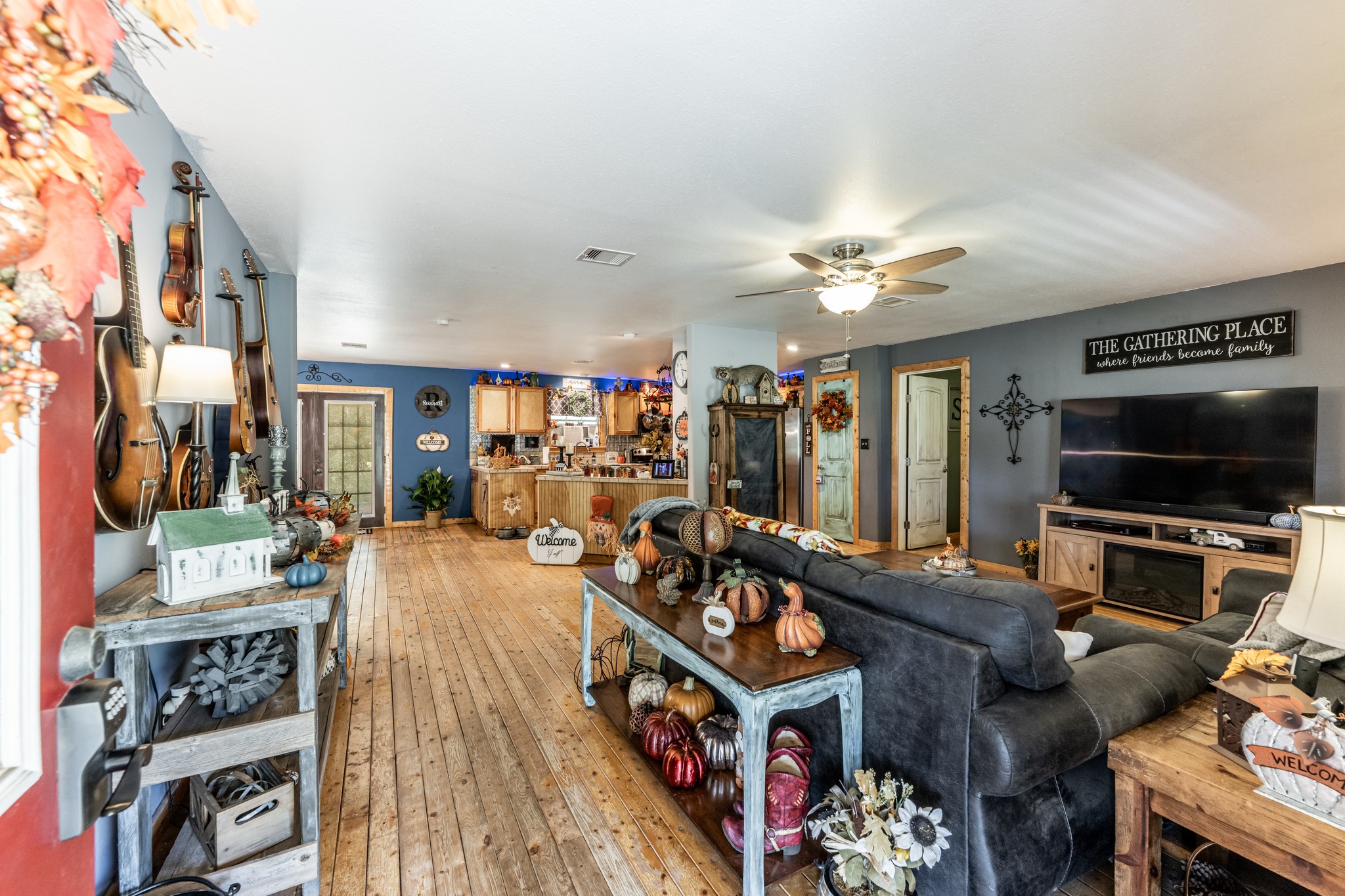 230 Thomas Creek Road Cleveland, TX 77328 - Photo 4 of 28 a living room with furniture and a flat screen tv
