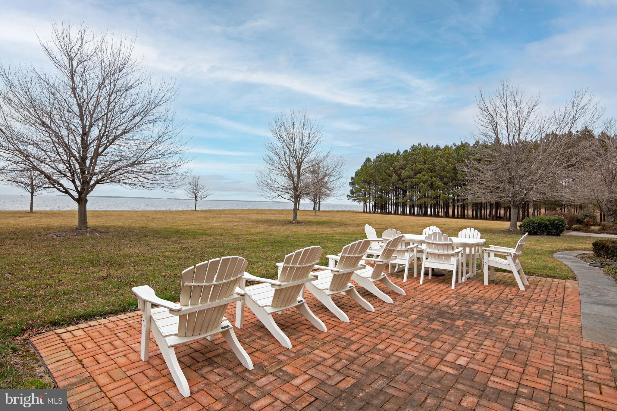 8781 Tilghman Island Road Wittman, MD 21676 - Photo 27 of 60 a view of an ocean with a table and chairs