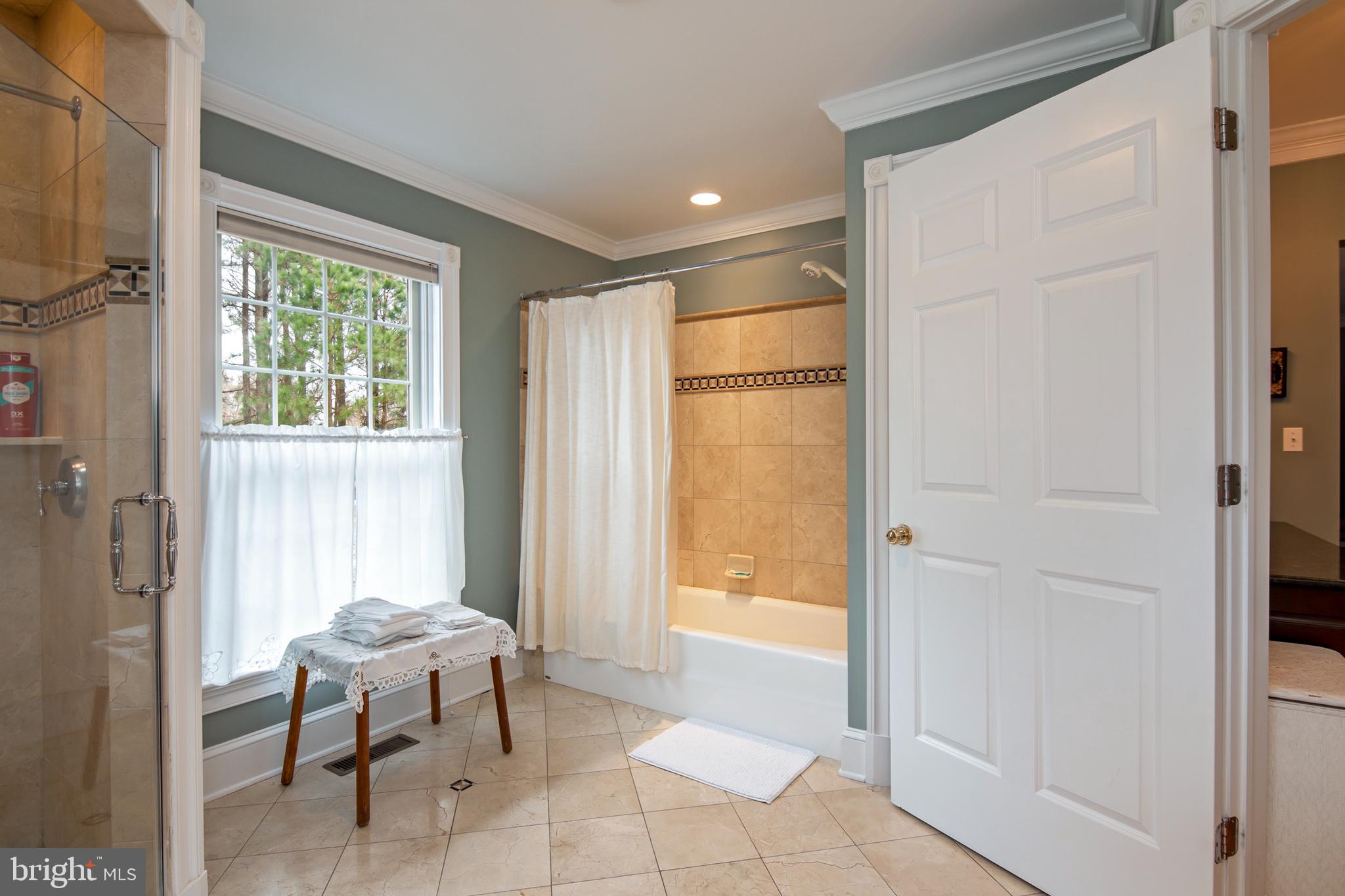 8781 Tilghman Island Road Wittman, MD 21676 - Photo 38 of 60 a bathroom with a tub and a sink