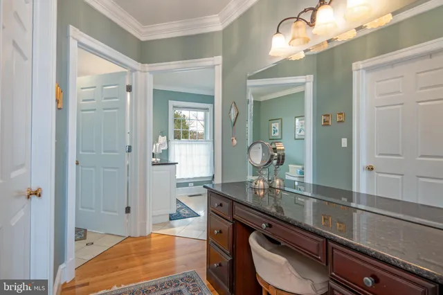 a bathroom with a toilet a sink and a mirror