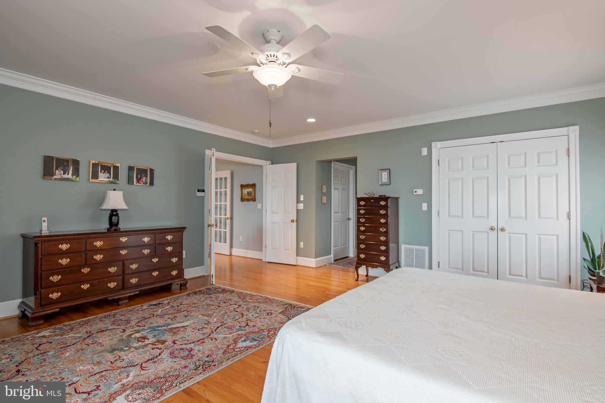 8781 Tilghman Island Road Wittman, MD 21676 - Photo 41 of 60 a spacious bedroom with a bed and a dresser in it