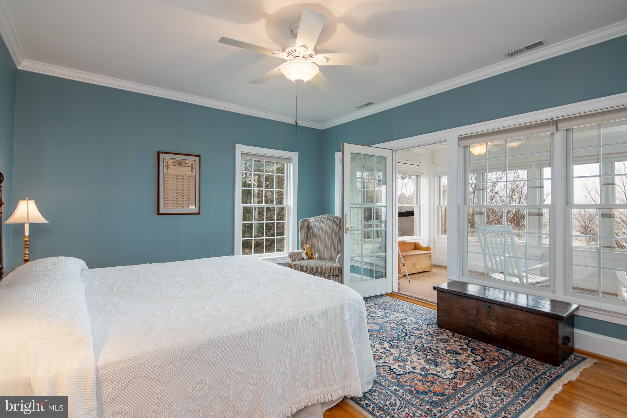 8781 Tilghman Island Road Wittman, MD 21676 - Photo 42 of 60 a spacious bedroom with a large bed and a window