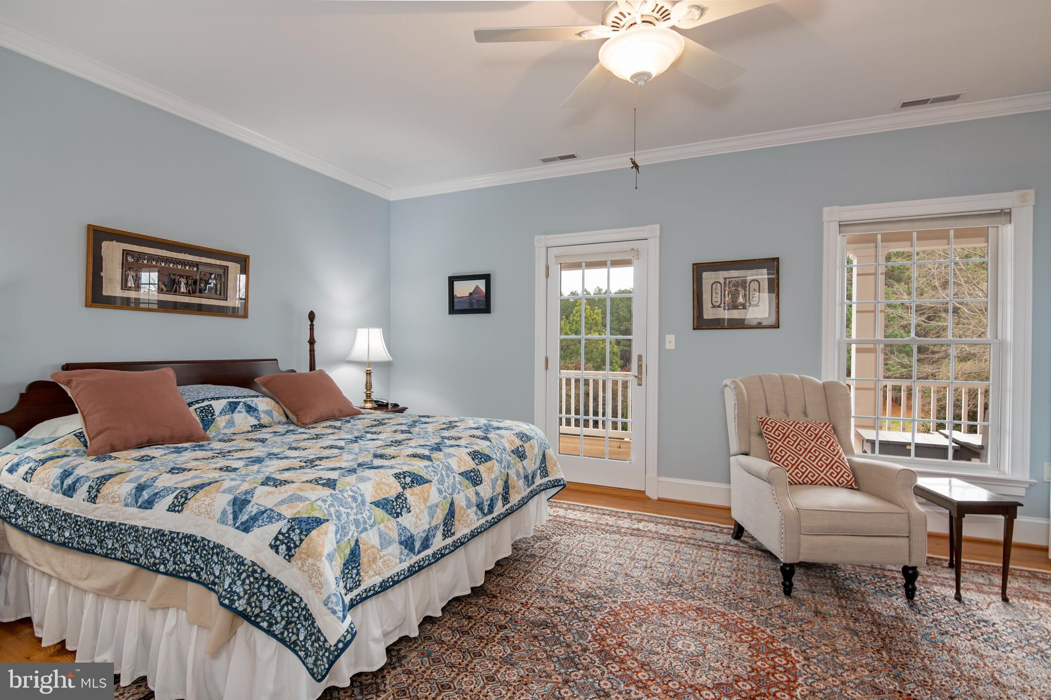 8781 Tilghman Island Road Wittman, MD 21676 - Photo 43 of 60 a bedroom with a bed and a couch