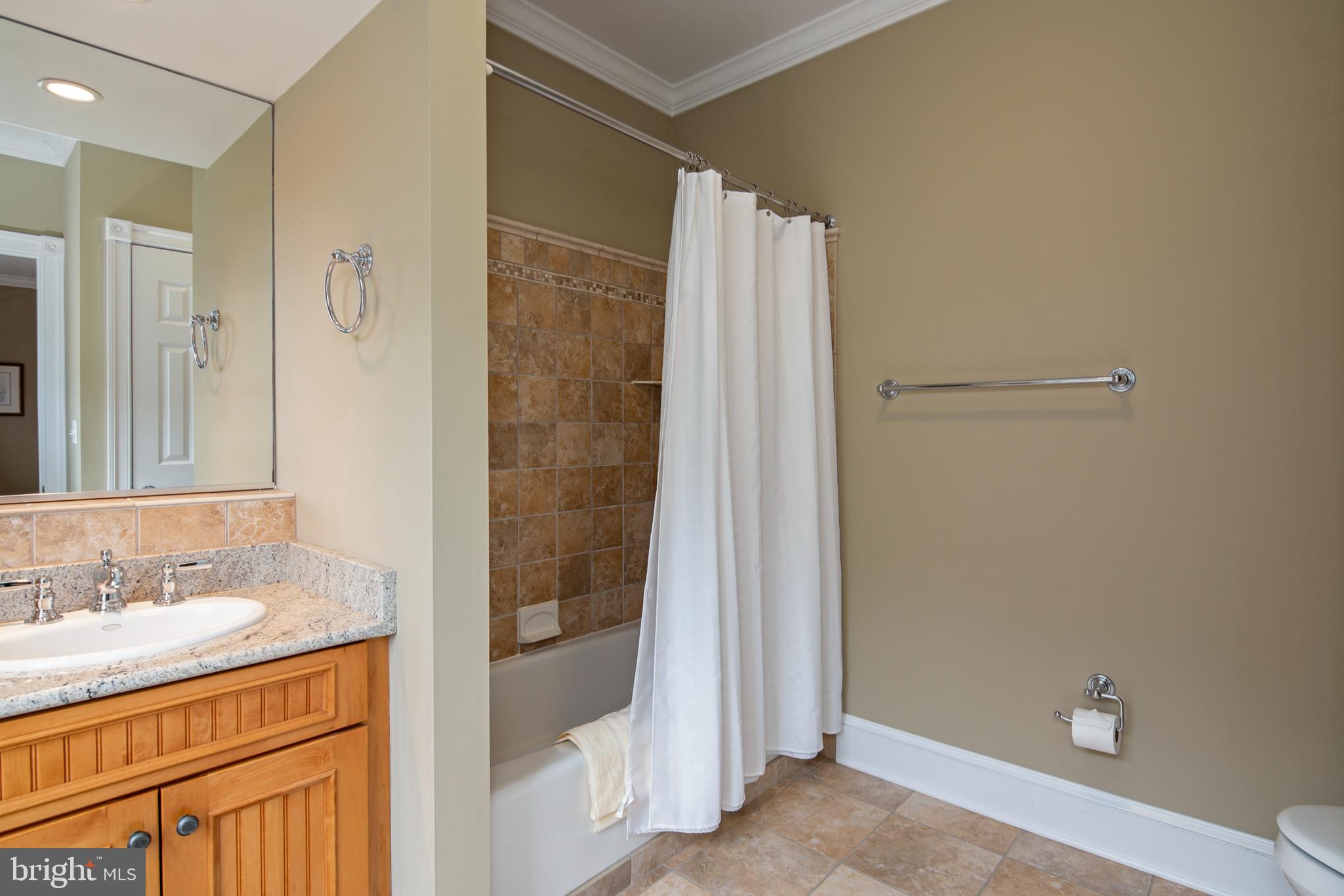 8781 Tilghman Island Road Wittman, MD 21676 - Photo 46 of 60 a bathroom with a sink and a mirror