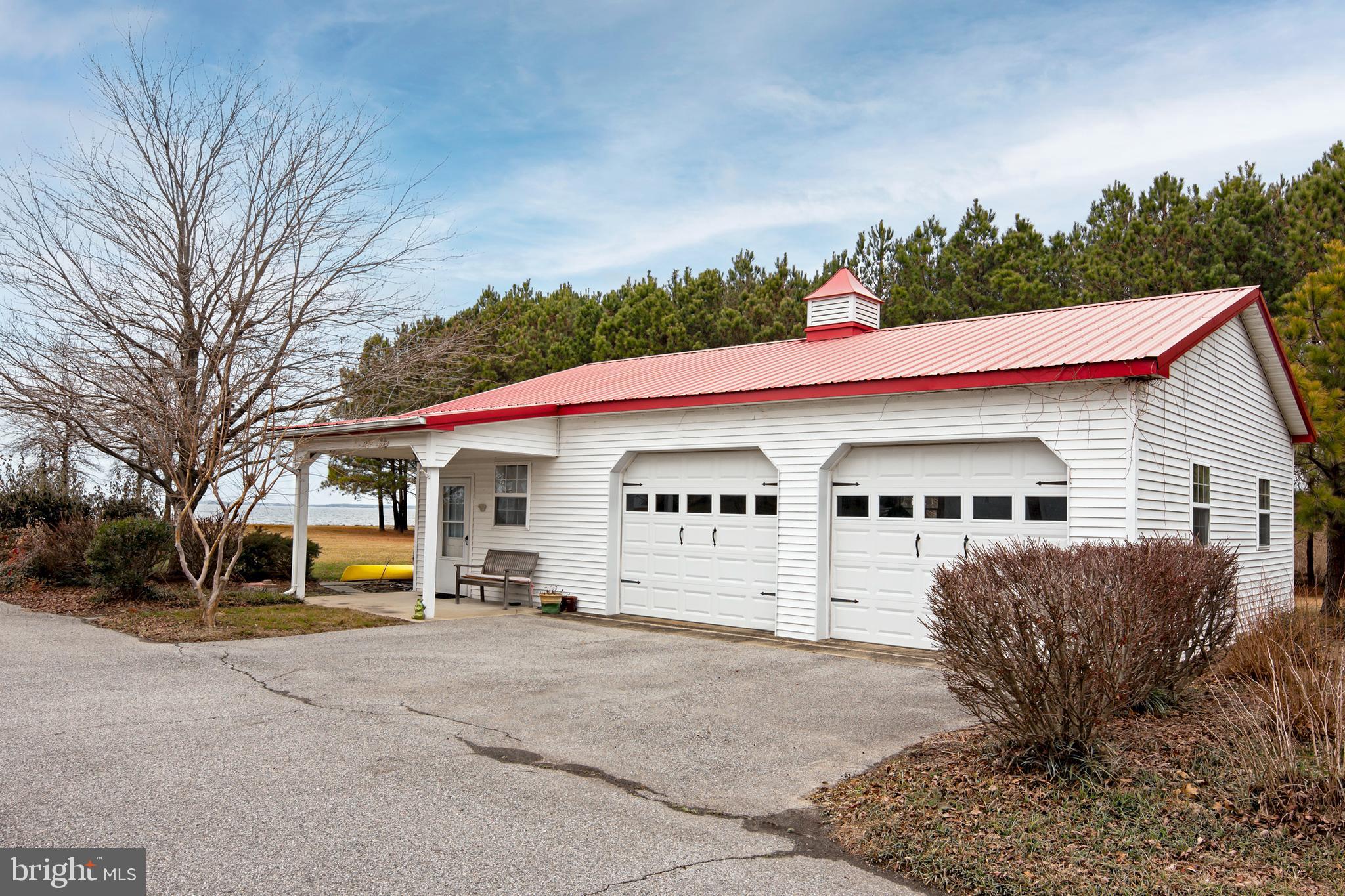 8781 Tilghman Island Road Wittman, MD 21676 - Photo 55 of 60 a view of house with outdoor space and car parked