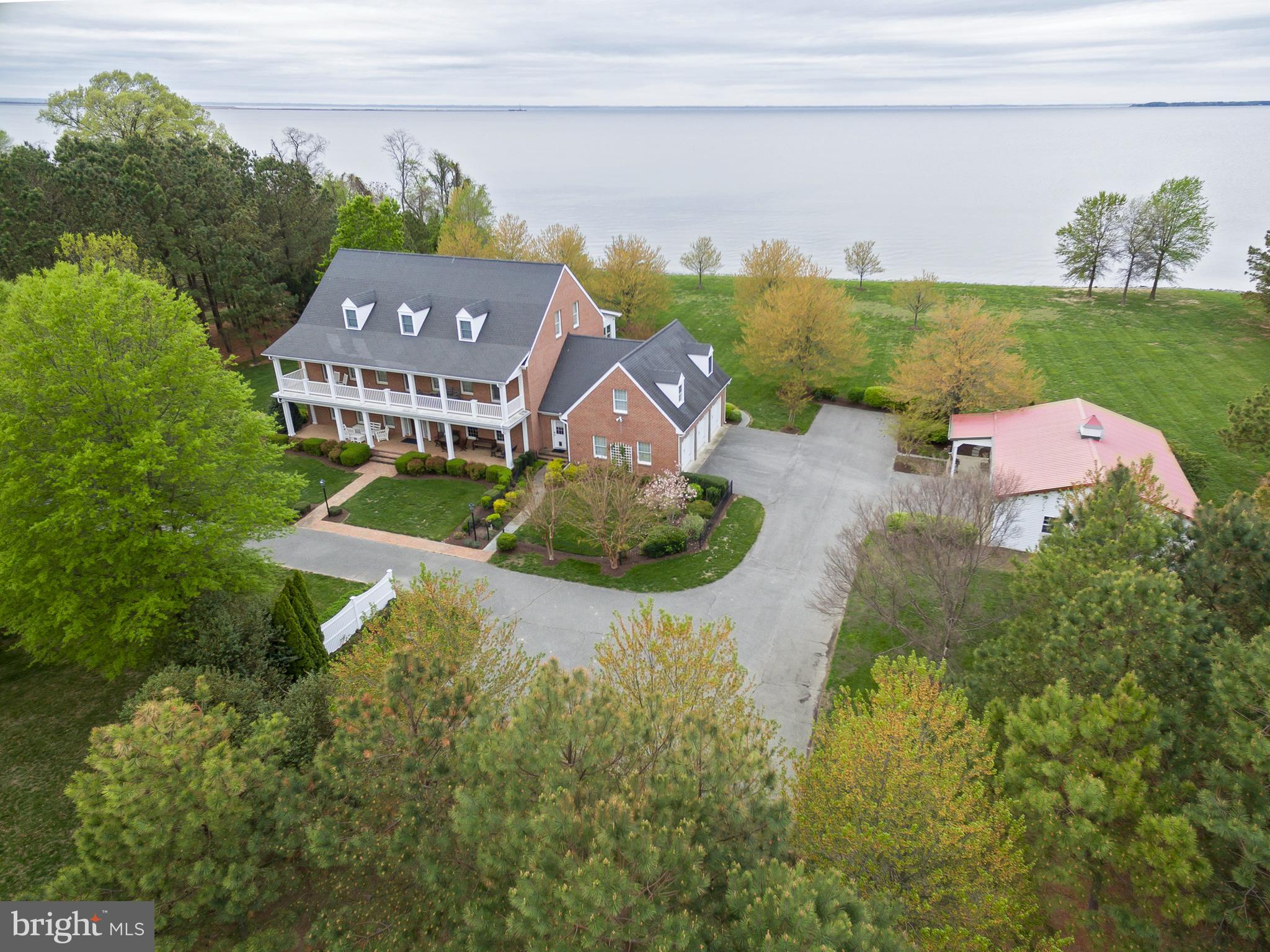 8781 Tilghman Island Road Wittman, MD 21676 - Photo 6 of 60 an aerial view of a house with garden space and lake view