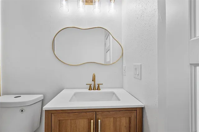 an empty room with a empty space and a ceiling fan