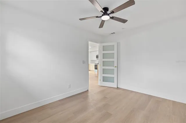 a bathroom with a shower a toilet and a sink