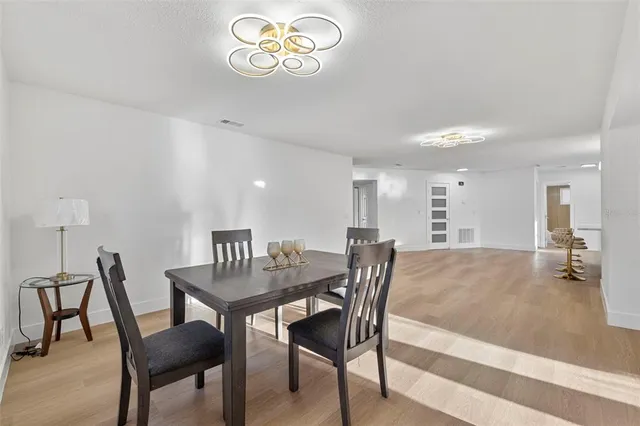 a front view of a house with garden and porch