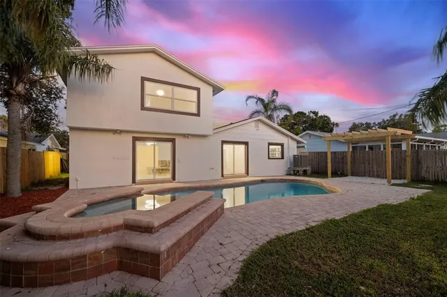 an aerial view of residential houses with city view and lake view