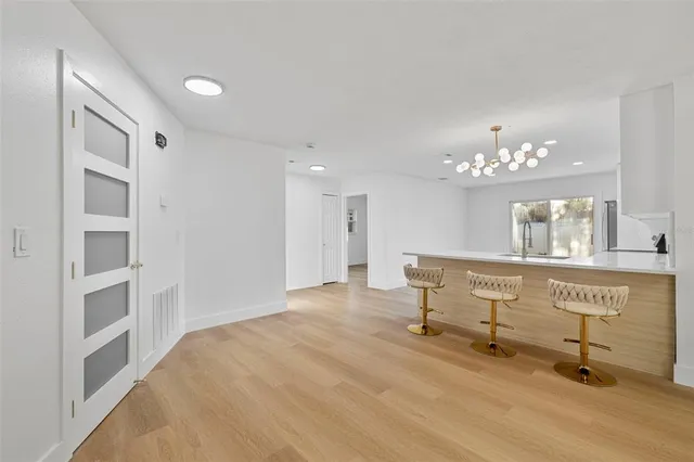 a kitchen with a refrigerator and a sink