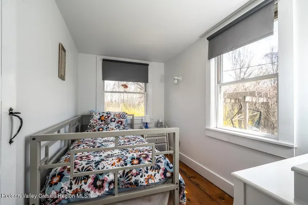 a bed room with a bed and a window