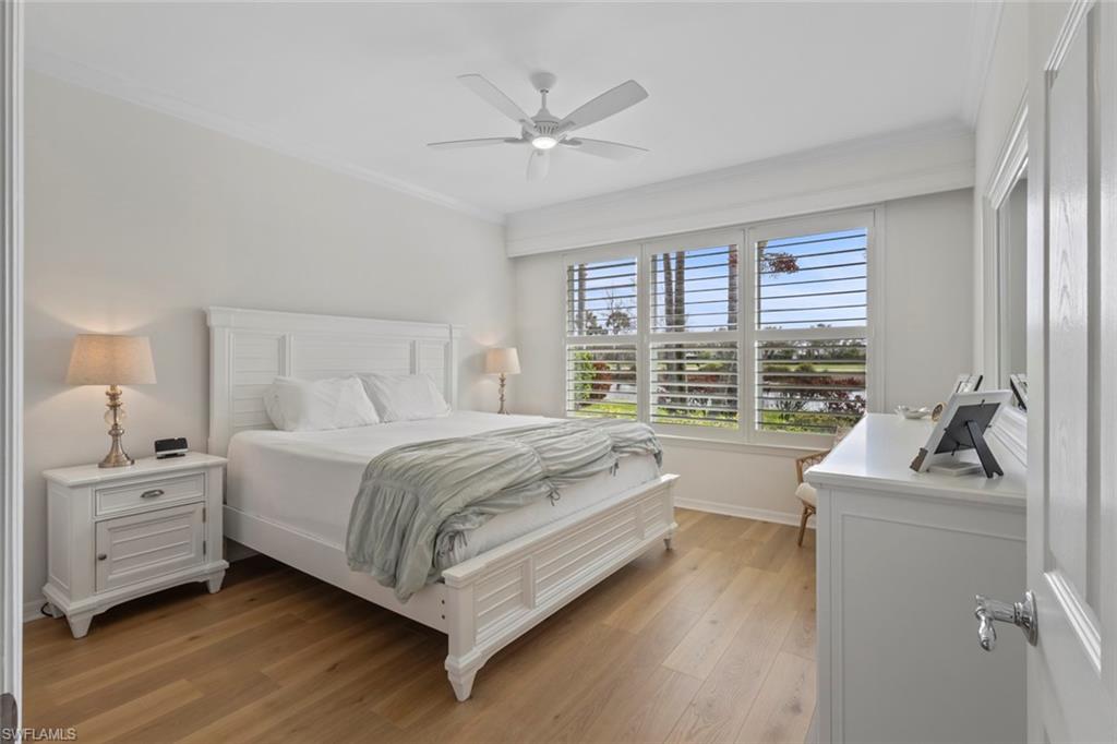 5868 Constitution Street Ave Maria, FL 34142 - Photo 12 of 33 a bedroom with a bed a couch and a large window