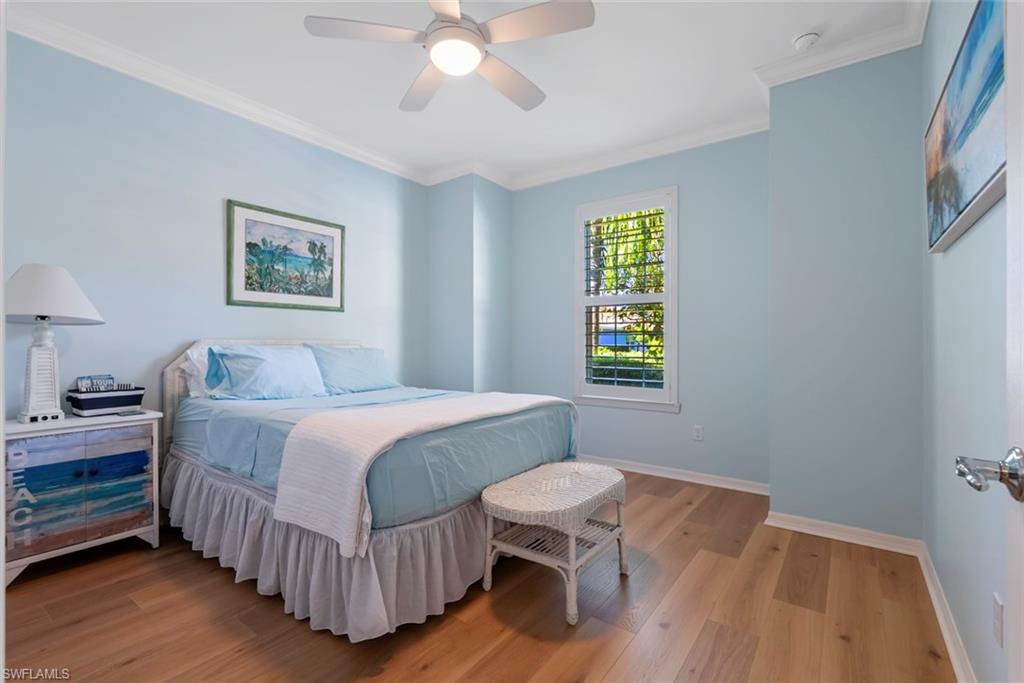 5868 Constitution Street Ave Maria, FL 34142 - Photo 16 of 33 a bedroom with a bed window and a chair