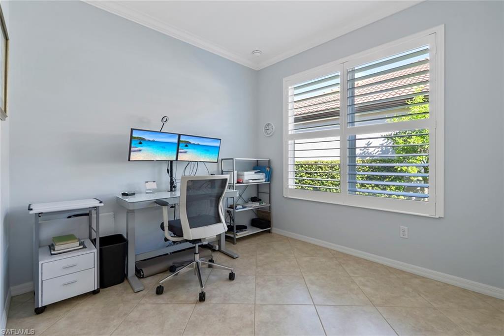 5868 Constitution Street Ave Maria, FL 34142 - Photo 18 of 33 a view of a workspace with furniture and a window