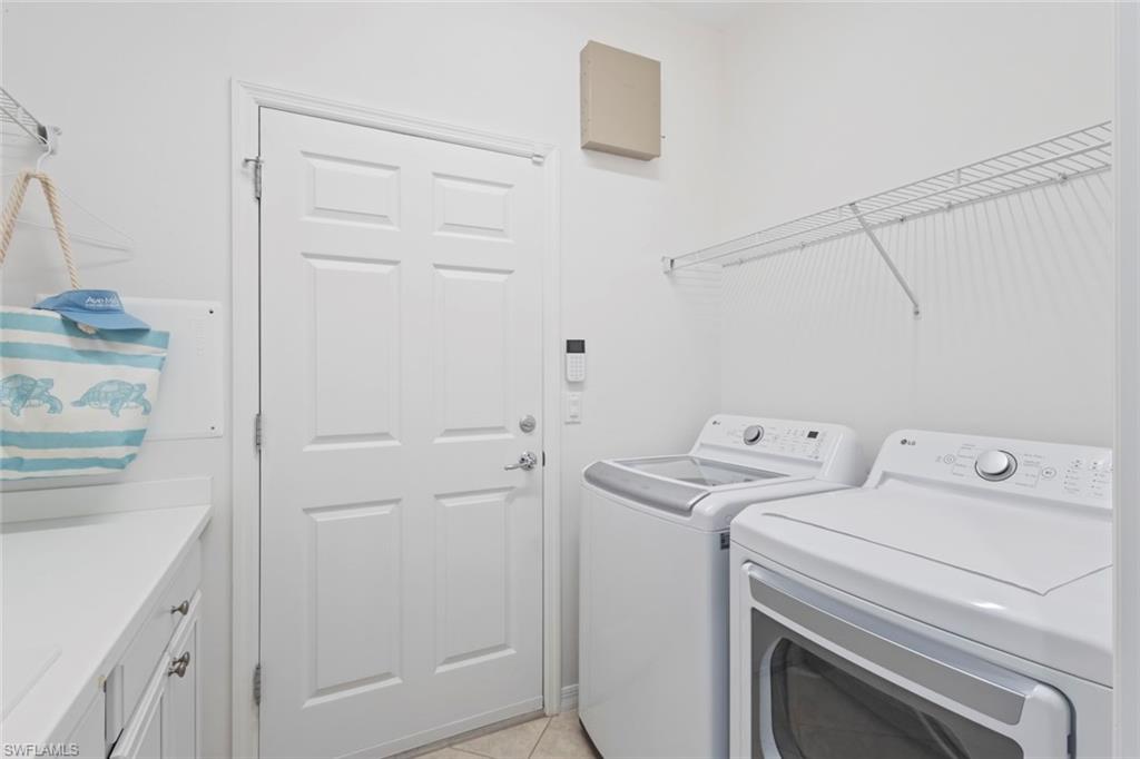 5868 Constitution Street Ave Maria, FL 34142 - Photo 19 of 33 a utility room with dryer and washer