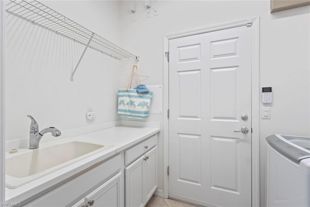 5868 Constitution Street Ave Maria, FL 34142 - Photo 20 of 33 a bathroom with a sink a toilet and shower