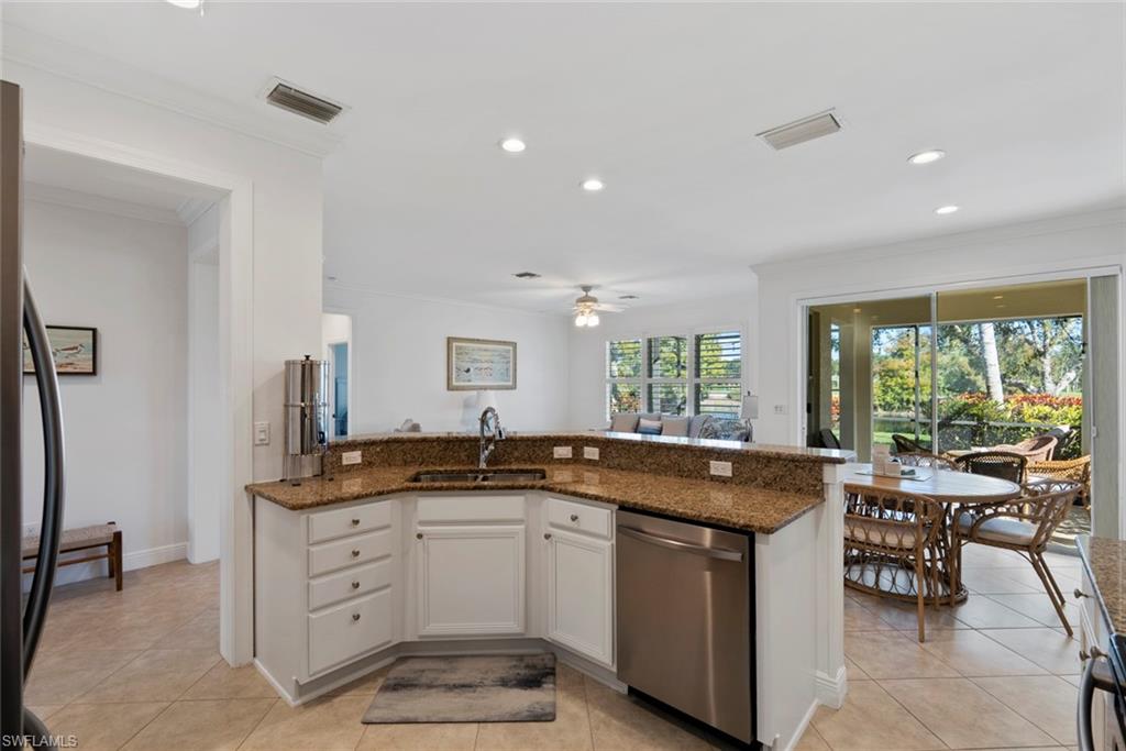 5868 Constitution Street Ave Maria, FL 34142 - Photo 9 of 33 a kitchen with a sink and large window