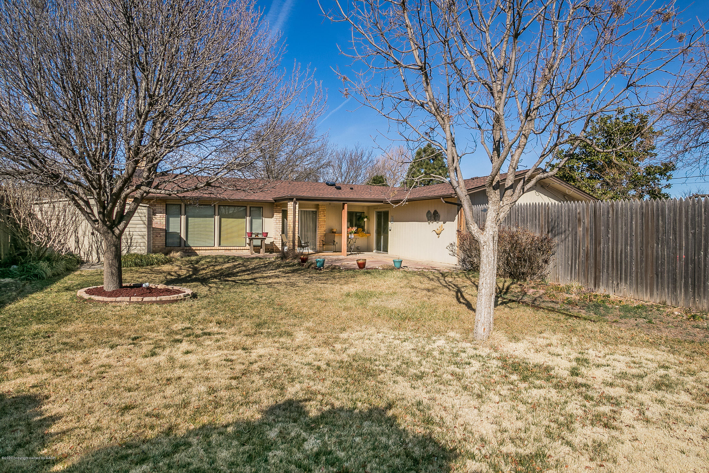 4609 Journey Street Amarillo, TX 79110 - Photo 21 of 30 a front view of a house with a yard