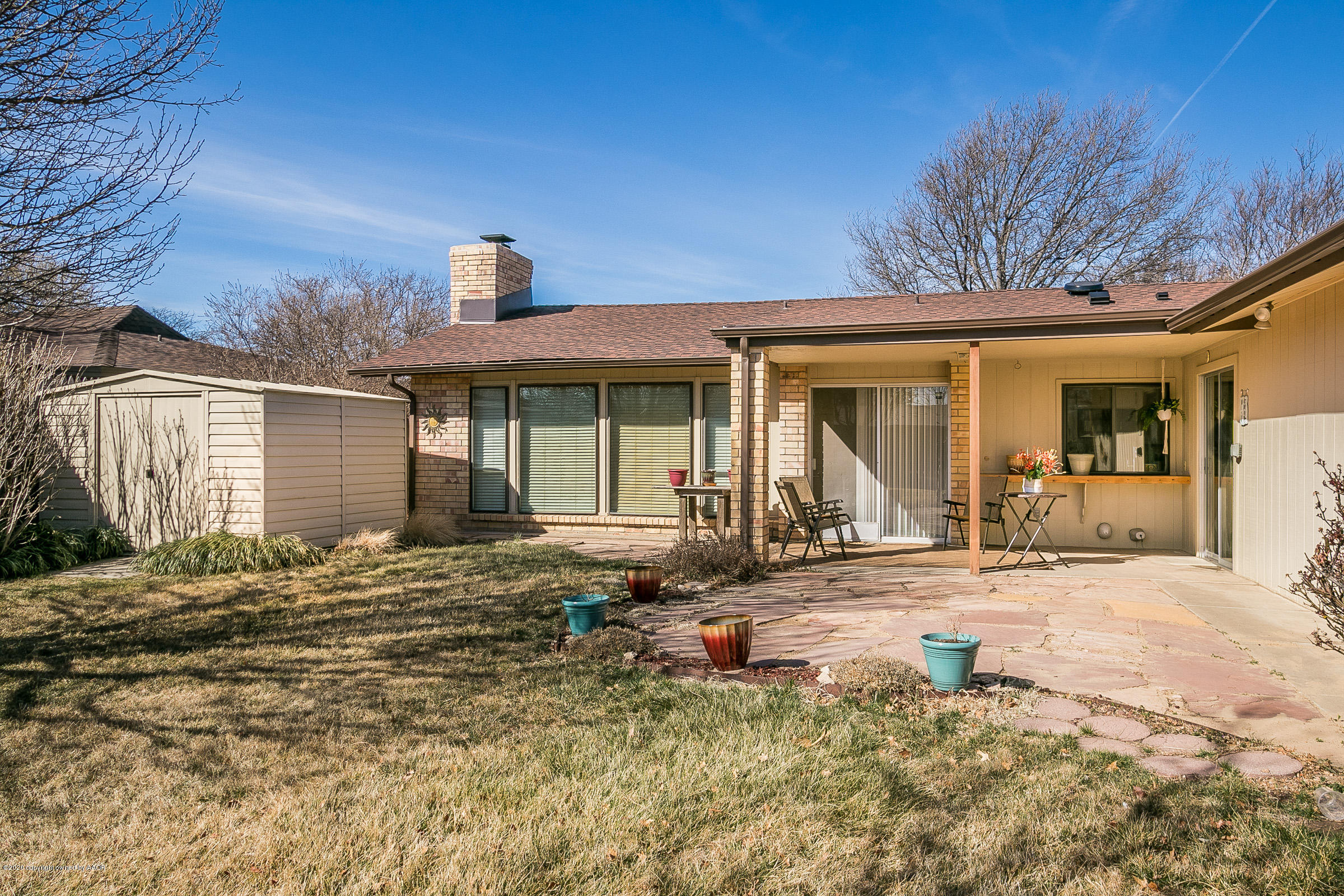 4609 Journey Street Amarillo, TX 79110 - Photo 22 of 30 a front view of a house with garden