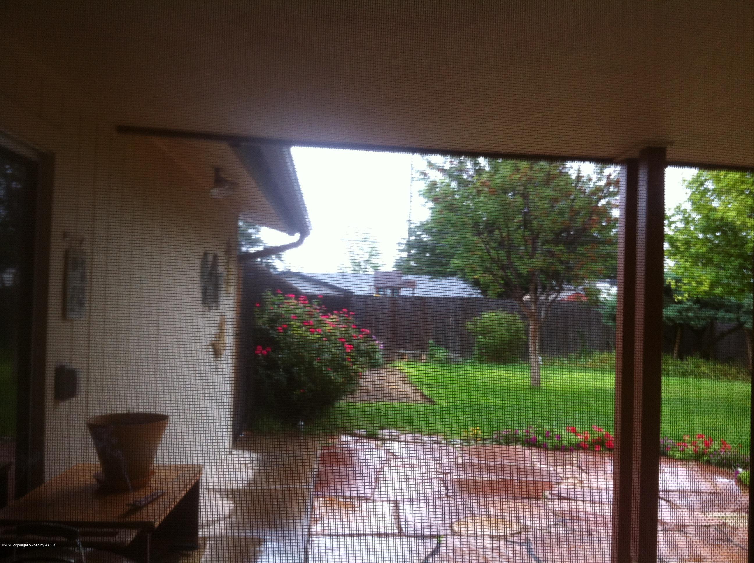 4609 Journey Street Amarillo, TX 79110 - Photo 25 of 30 a view of a porch with furniture and garden