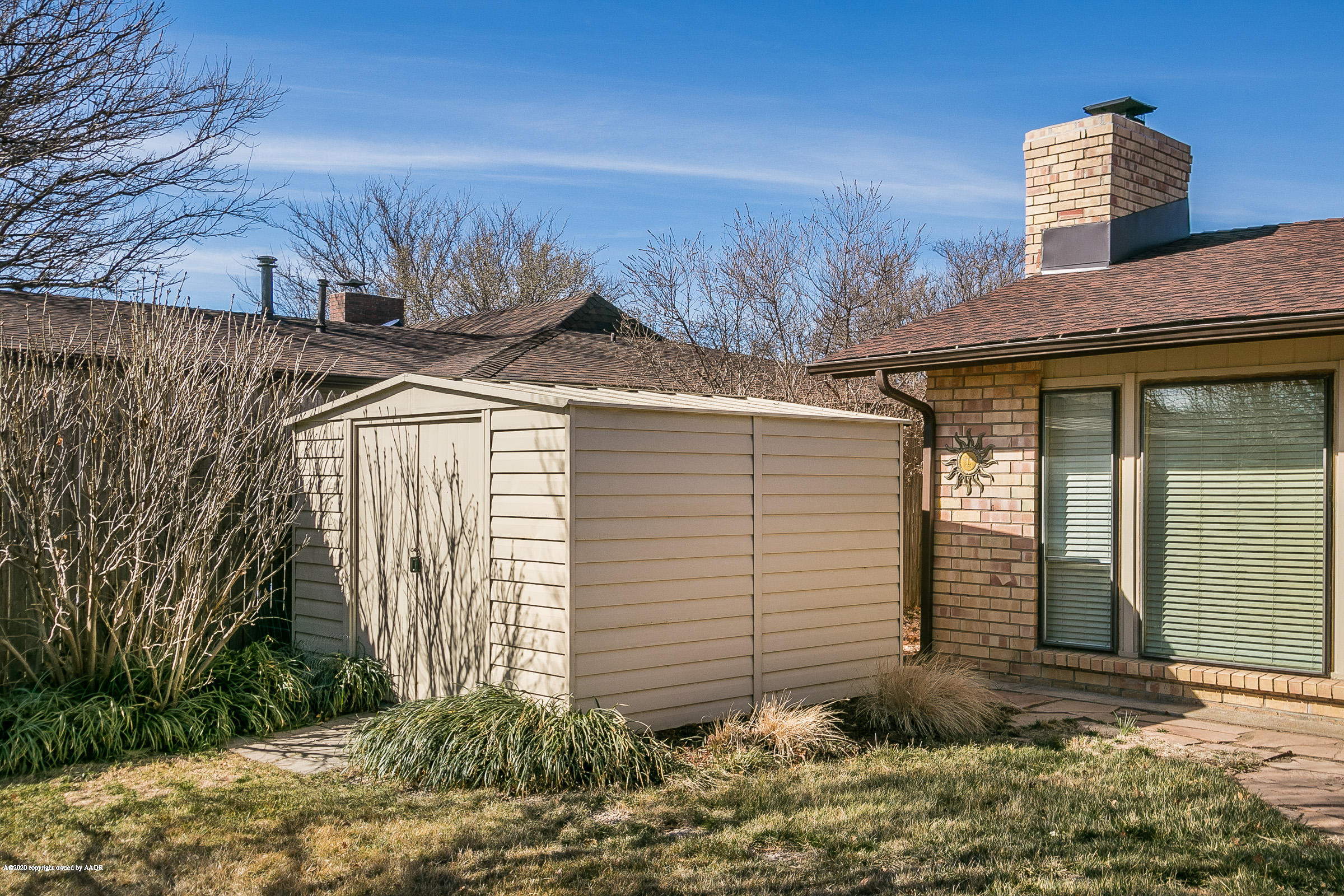 4609 Journey Street Amarillo, TX 79110 - Photo 27 of 30 a view of a house with a yard