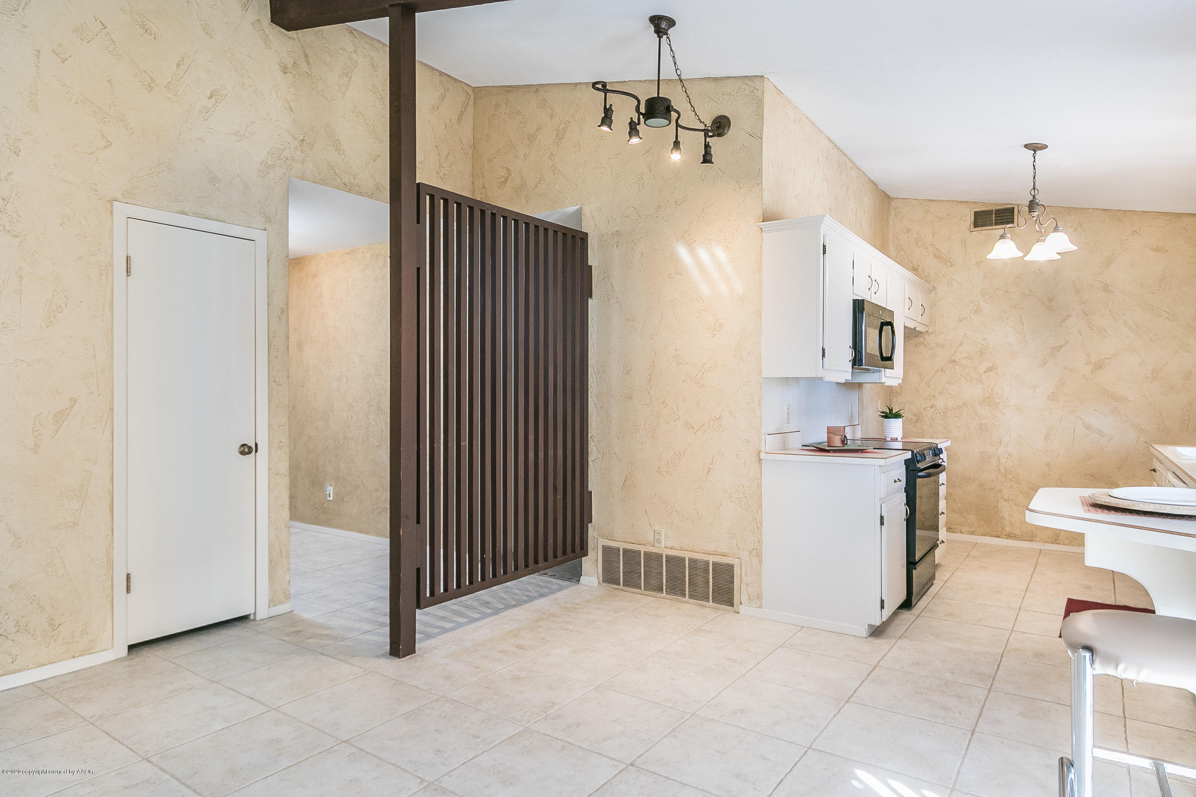 4609 Journey Street Amarillo, TX 79110 - Photo 9 of 30 a view of a hallway with a livingroom and a kitchen