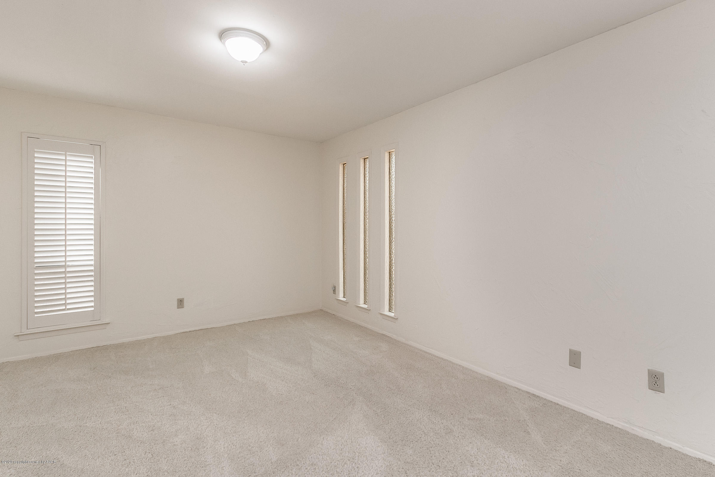 4609 Journey Street Amarillo, TX 79110 - Photo 10 of 30 an empty room with windows